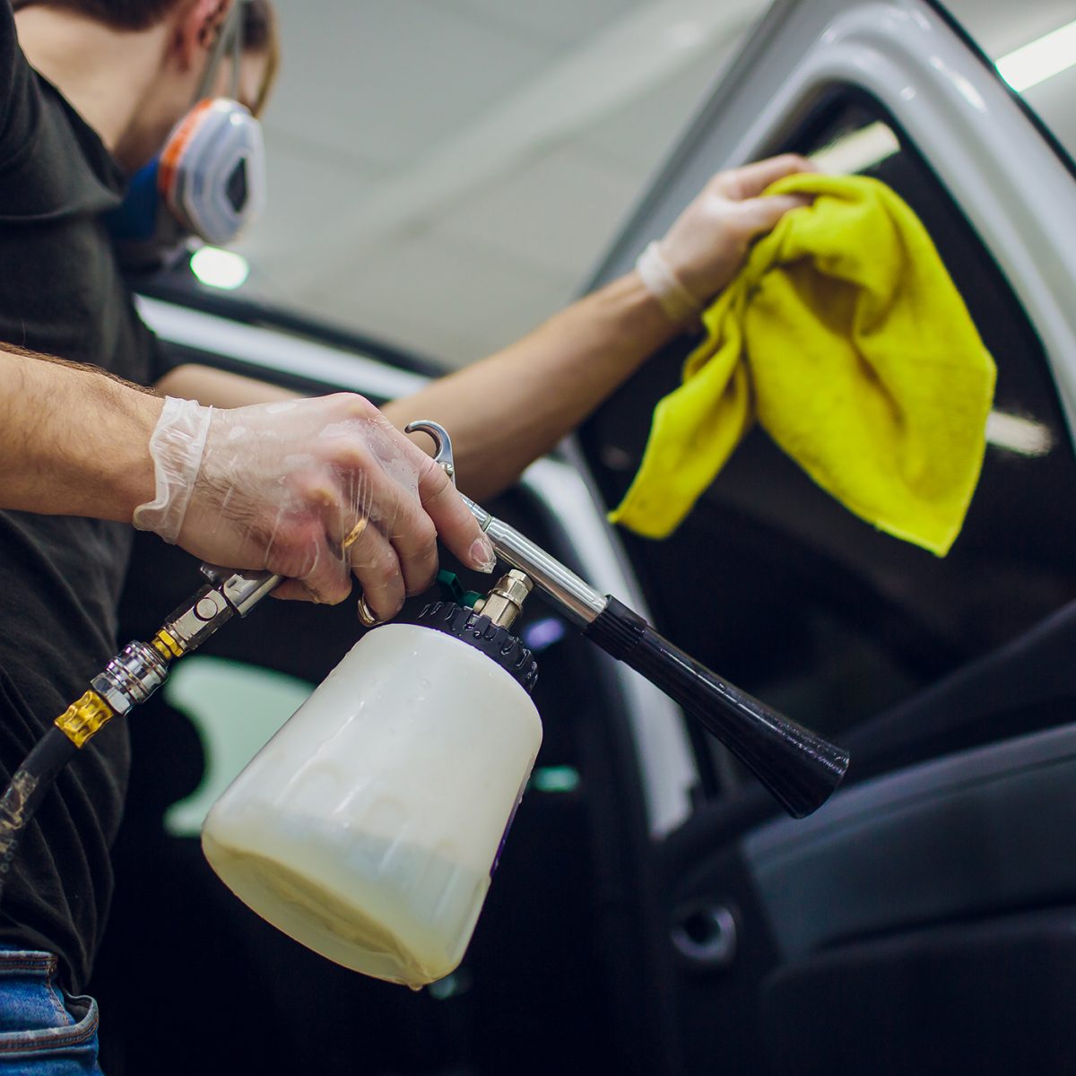 handsome-man-cleaning-car-with-hot-steam-1